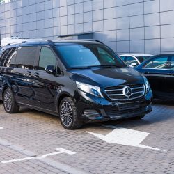 Black Mercedes-Benz V class, front view mini bus in a row in a parking lot. Russia, Saint-Petersburg. 26 march 2020